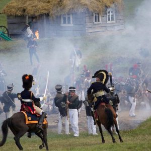 soldiers in historical clothes during reenactment of battle during napoleonic war