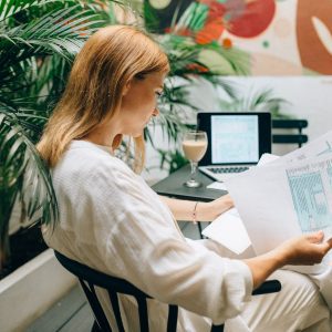 a woman reviewing documents while sitting