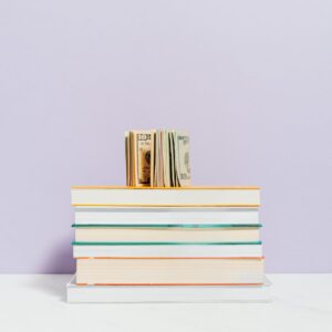 money on top of a stack of books