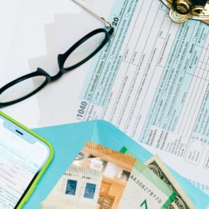 income tax return form beside black eyeglasses