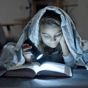 young girl reading a book